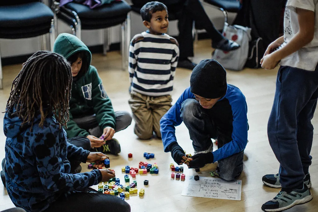 Children group playing with cubes